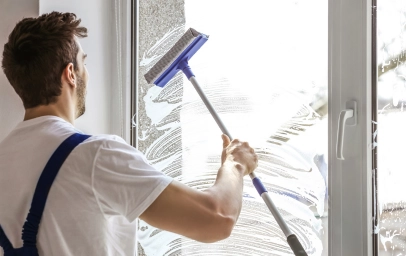 Man cleaning window